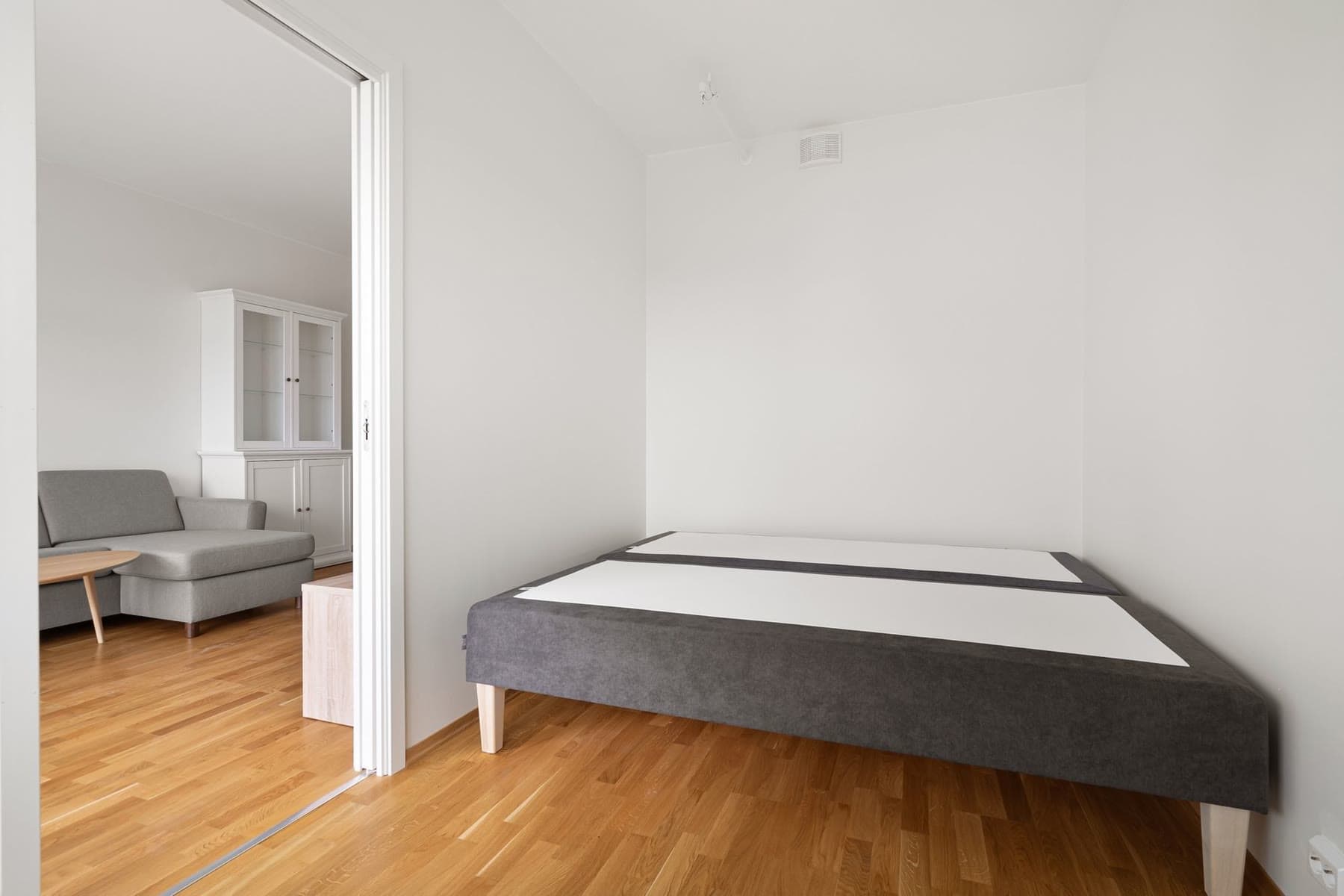A bright, freshly made bedroom in a Singapore home