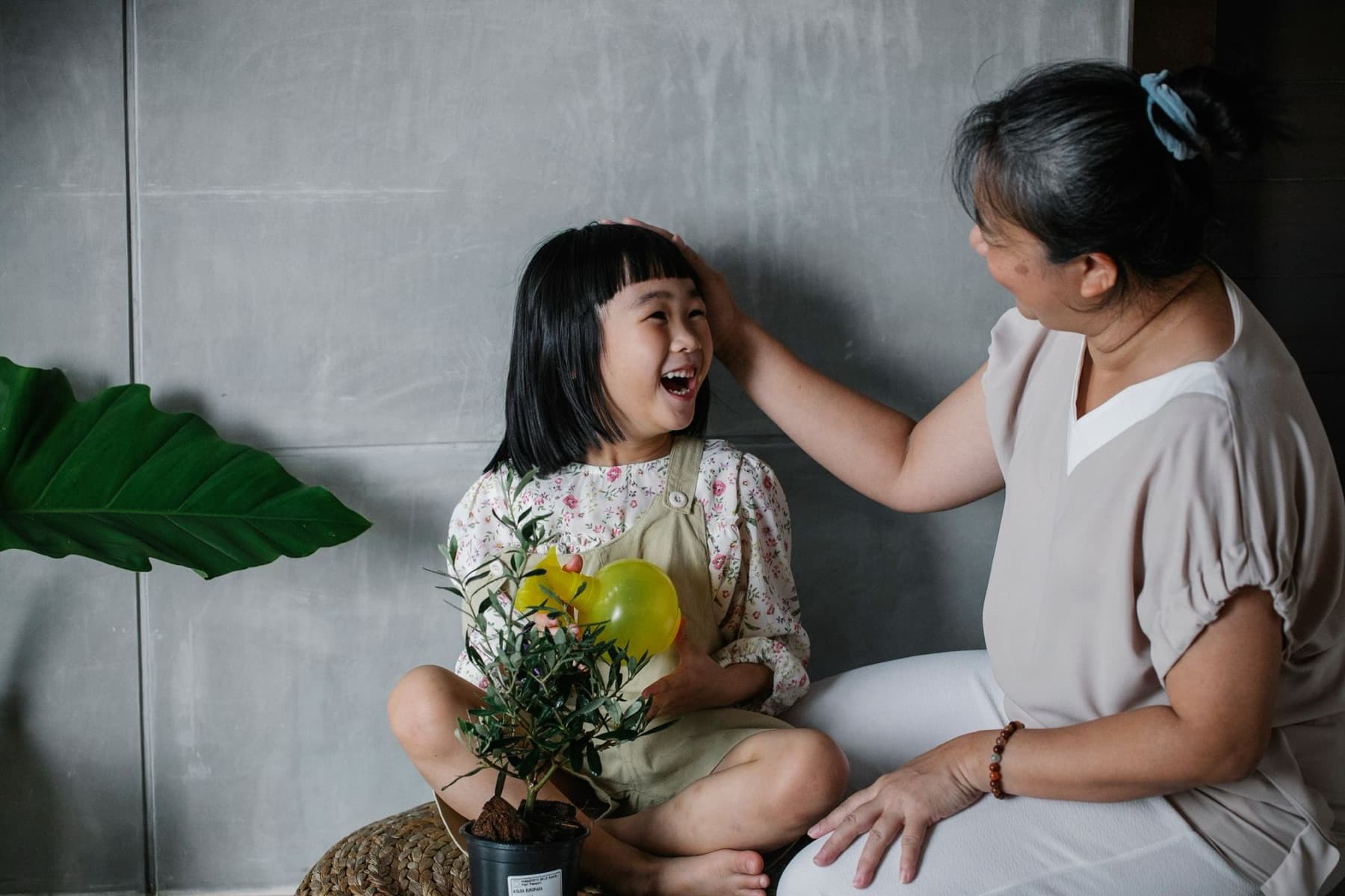 A grandmother and child sharing a warm moment at home